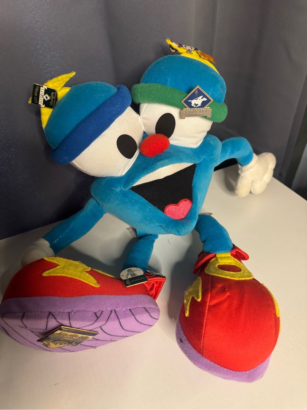 1996 Atlanta Olympic mascot plush (“Izzy”) 
- MULTIPLE PINS INCLUDED